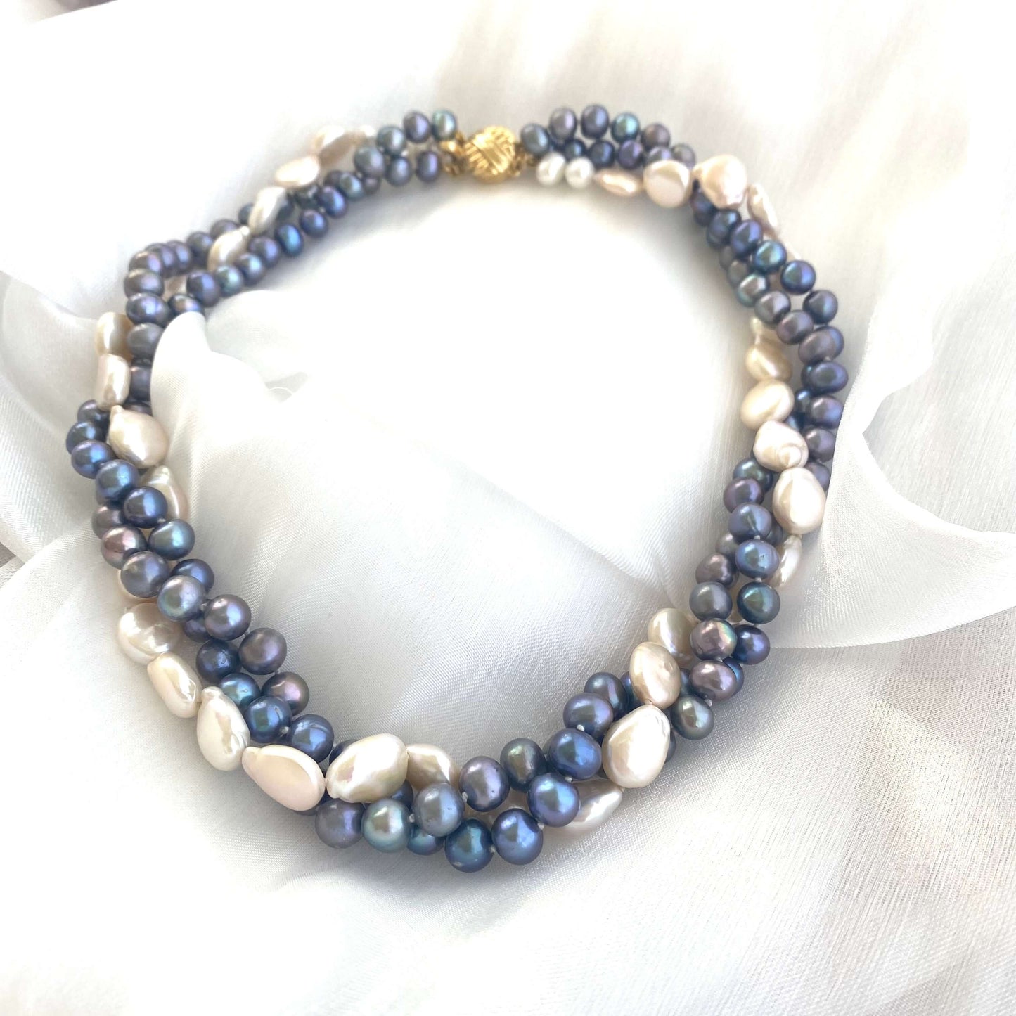 Detailed close-up of Black and White Pearl Necklace showing central white coin pearl and gold vermeil clasp.