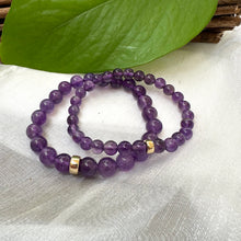 Charger l'image dans la galerie, Amethyst Bracelet pair displayed on white cloth – two-bracelet product image