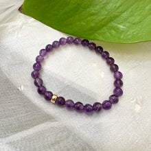 Charger l'image dans la galerie, Amethyst Bracelet displayed on white cloth – gemstone bead close-up