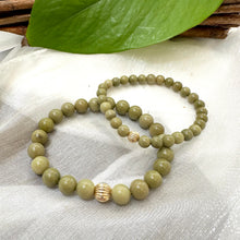 Load image into Gallery viewer, Green Olivine Jasper Bracelet pair displayed on cloth – two-bracelet close-up