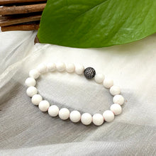 Load image into Gallery viewer, White Tridacna Bracelet on white cloth – detailed bead and CZ accent shot