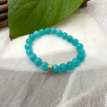 Load image into Gallery viewer, Blue Amazonite Bracelet on white cloth – bead and gold accent detail shot