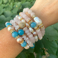 Load image into Gallery viewer, Rose quartz stretch bracelet with gold accent beads, featuring pearls and turquoise stones, stacked stylishly on a wrist.