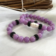 Load image into Gallery viewer, Lavender jade bracelets with and without pearl side by side on white cloth