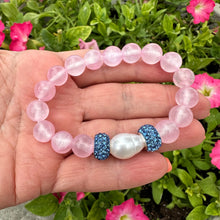 Load image into Gallery viewer, Pink jade bracelet featuring natural 10mm pink jade beads and a freshwater pearl, displayed on a hand.
