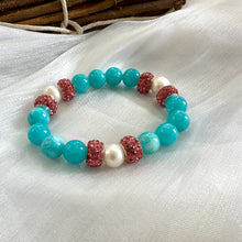 Load image into Gallery viewer, Teal jade bracelet with pearls and pink rhinestones showcasing vibrant colors and handmade craftsmanship.