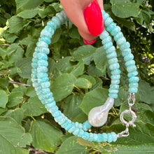 Load image into Gallery viewer, Amazonite and white baroque pearl necklace displayed outdoors against green leaves background