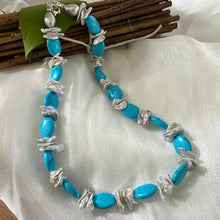 Load image into Gallery viewer, Chunky turquoise and silver grey keshi pearl necklace displayed on white cloth background
