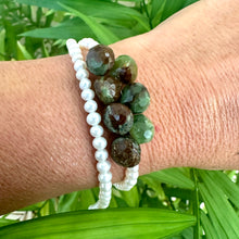 Load image into Gallery viewer, Double wrap pearl bracelet with green chrysoprase worn by female model against green foliage