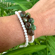 Load image into Gallery viewer, Close-up of double wrap pearl bracelet with green chrysoprase on wrist in natural light