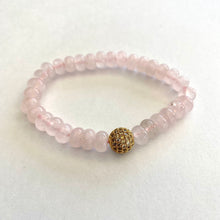 Load image into Gallery viewer, Rose quartz stretch bracelet with gold accent beads for a stylish and elegant accessory.