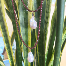 Load image into Gallery viewer, Red garnet baroque pearl necklace with vibrant garnet beads and a luminous Baroque pearl pendant on display.
