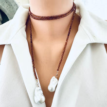 Load image into Gallery viewer, Hessonite Garnet and Baroque Pearl Lariat Necklace worn choker style on mannequin in white blouse, designed and handmade in Canada.