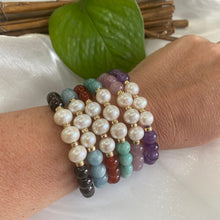 Charger l'image dans la galerie, Amethyst Pearl Bracelet worn with other colourful bracelets on woman’s wrist – stacked look