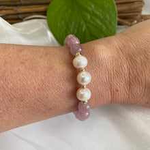 Load image into Gallery viewer, Rose Quartz Pearl Bracelet shown on model’s wrist – natural light close-up