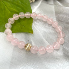 Load image into Gallery viewer, Rose Quartz Bracelet close-up on white cloth – pink gemstone bead texture