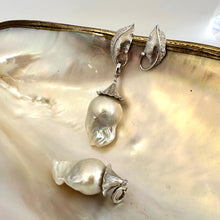 Charger l'image dans la galerie, Close-up of Leaf Design Baroque Pearl Earrings on white pearl backdrop — sterling silver and genuine baroque pearls handcrafted by Loulia Pearl Jewelry