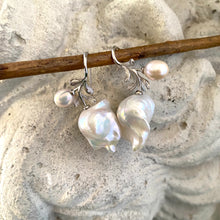 Charger l'image dans la galerie, Close-up of baroque pearl earrings in silver with rose leaf design on white background