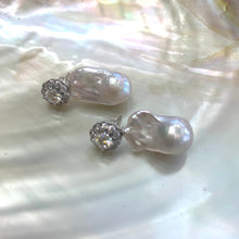 Charger l'image dans la galerie, Moissanite and baroque pearl earrings close-up on white pearl shell, handcrafted in Canada.