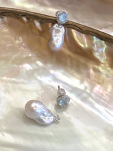 Load image into Gallery viewer, Convertible blue topaz pearl drop earrings with removable studs on shell background