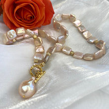 Charger l'image dans la galerie, Close-up of golden baroque pearl toggle necklace on white background — CZ pavé gold cube accents and lustrous pearls by Loulia Pearl Jewelry