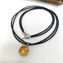 Charger l'image dans la galerie, Black spinel and citrine pendant necklace on white background, handmade silver design