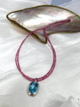 Charger l'image dans la galerie, Pink Tourmaline Blue Topaz Pendant on double-strand necklace, showcasing vibrant pink and blue gemstones.