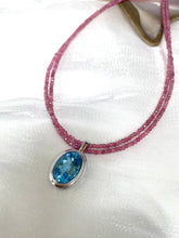 Charger l'image dans la galerie, Pink Tourmaline Blue Topaz Pendant | Double Strand Design by Loulia Pearl Jewelry on elegant fabric.