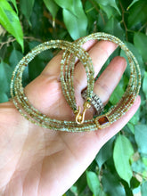 Charger l'image dans la galerie, Green orange garnet necklace showcasing multi-strand gold vermeil with green garnet beads and orange garnet centerpiece.