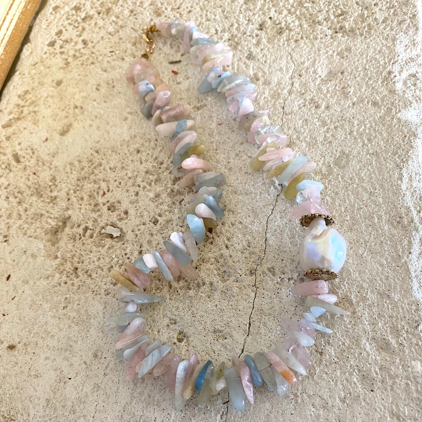 Morganite aquamarine necklace with baroque pearl, showcasing pastel gemstones and artisanal details.