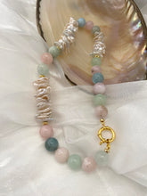 Charger l'image dans la galerie, Aquamarine Morganite Necklace – displayed on white cloth with pearl shell