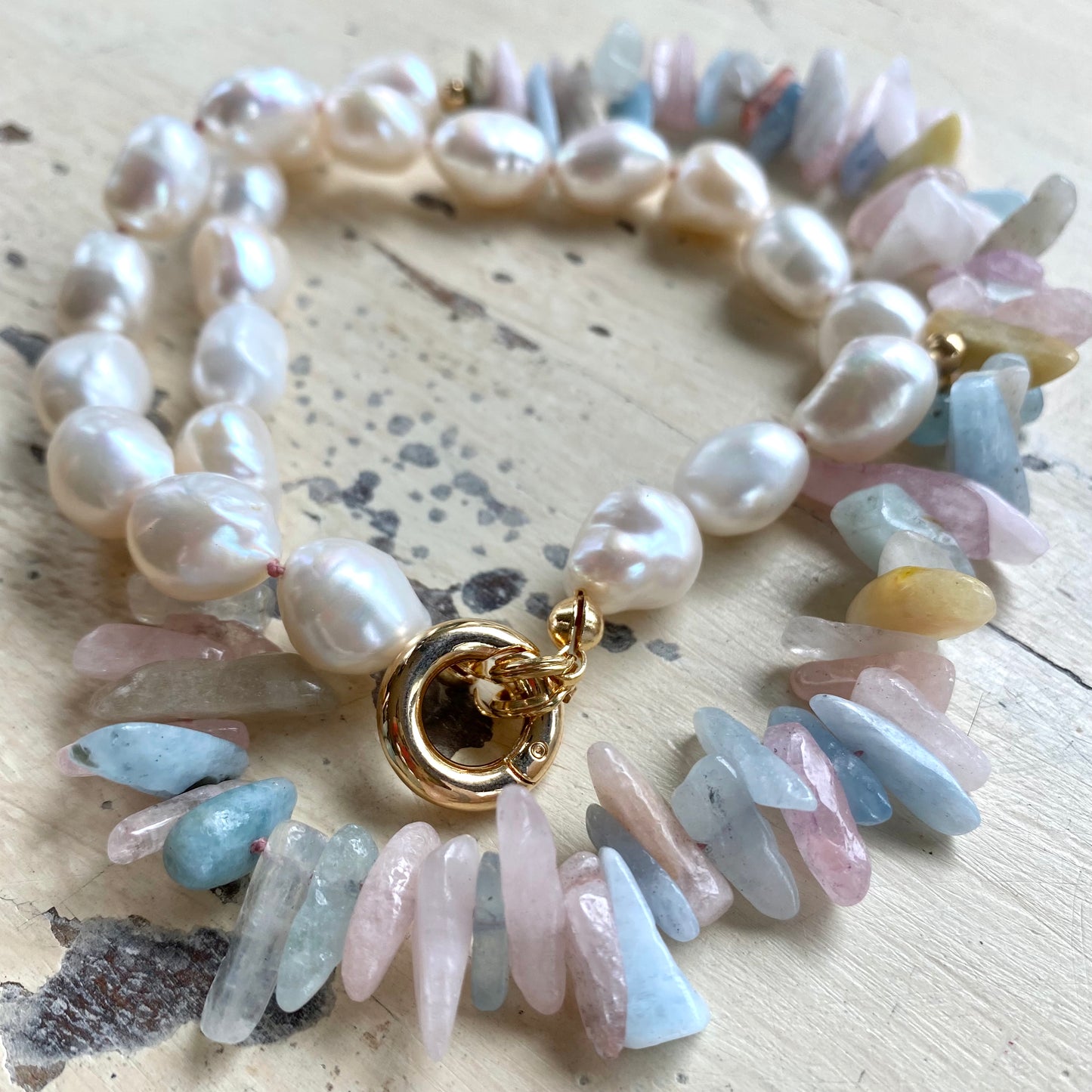 Morganite aquamarine necklace flat lay, hand-knotted pastel gemstones with removable push-lock clasp