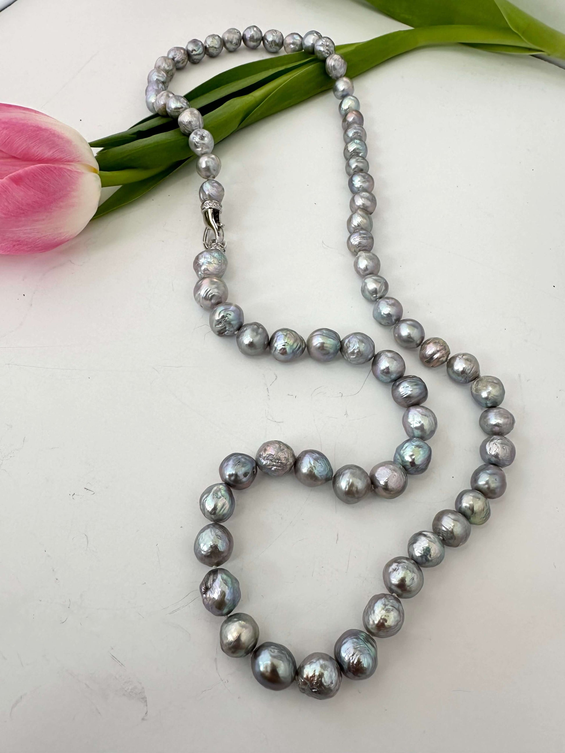Grey Edison baroque pearl necklace laid flat showing hand-knotted pearls and long convertible design
