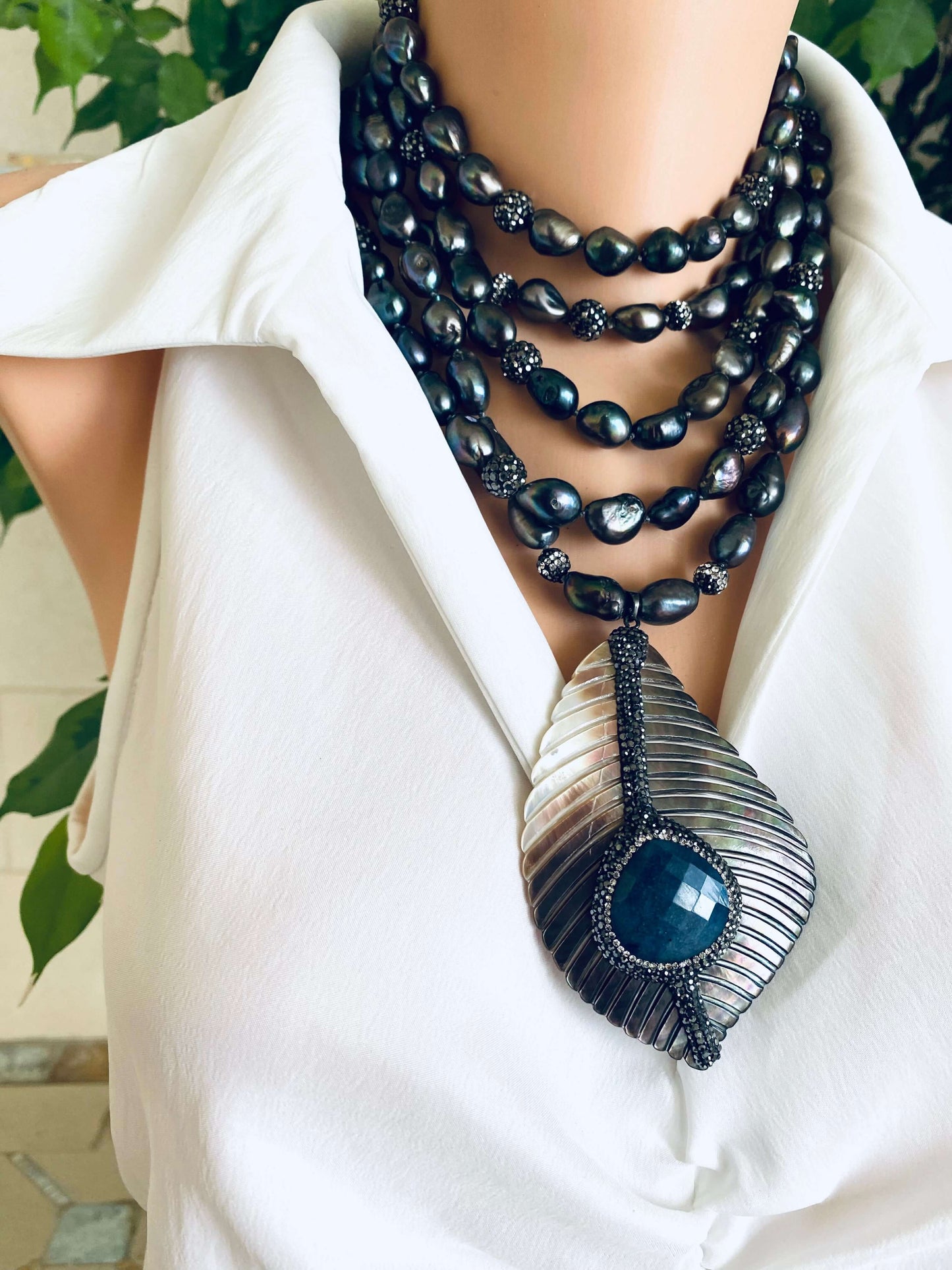 LIVE #80 - Long Peacock Black Pearl Necklace w/ Abalone Agate Pendant displayed elegantly on a mannequin.