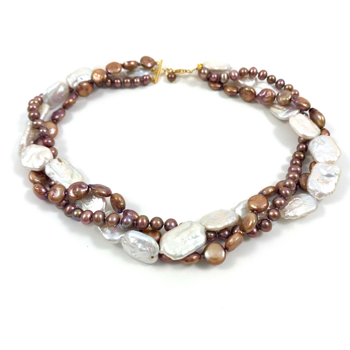 A multi-strand beaded necklace featuring brown and bronze pearls, irregular white baroque pearls, and small metallic gold beads, displayed on a clean white background.