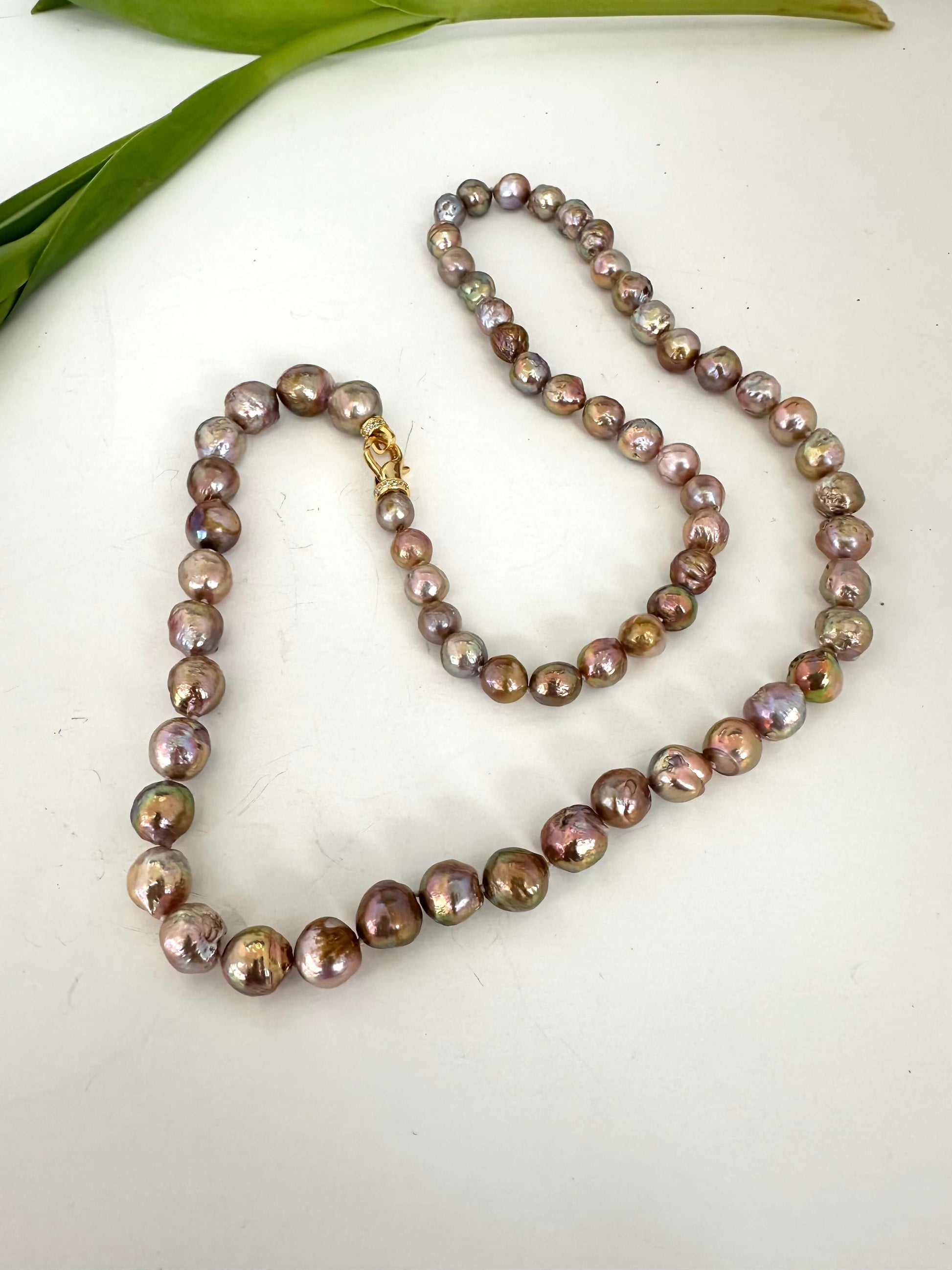 Long pink Edison baroque pearl necklace shown full length with convertible design
