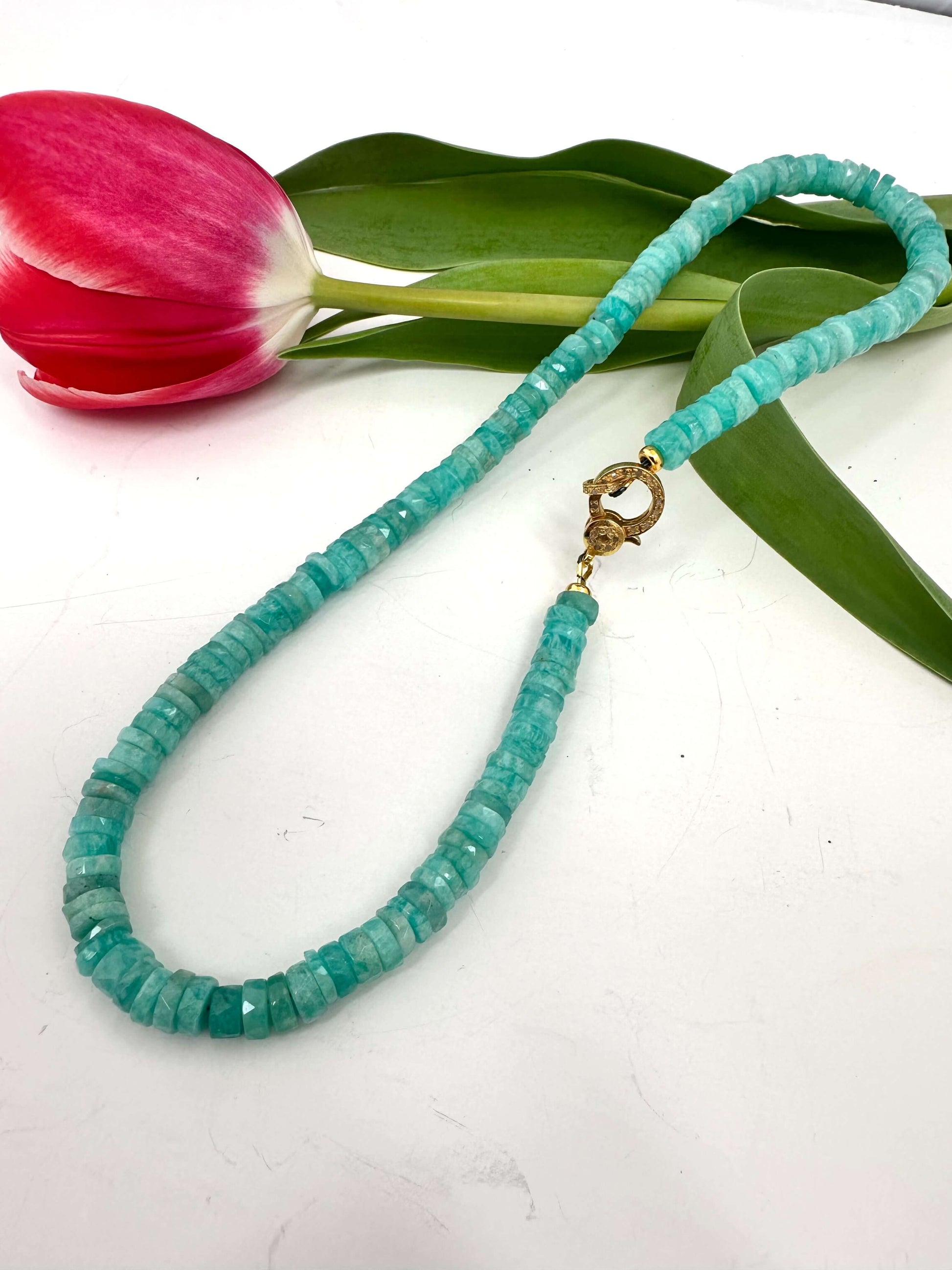 Blue amazonite gemstone necklace with diamond pavé gold vermeil clasp on a white background with tulip