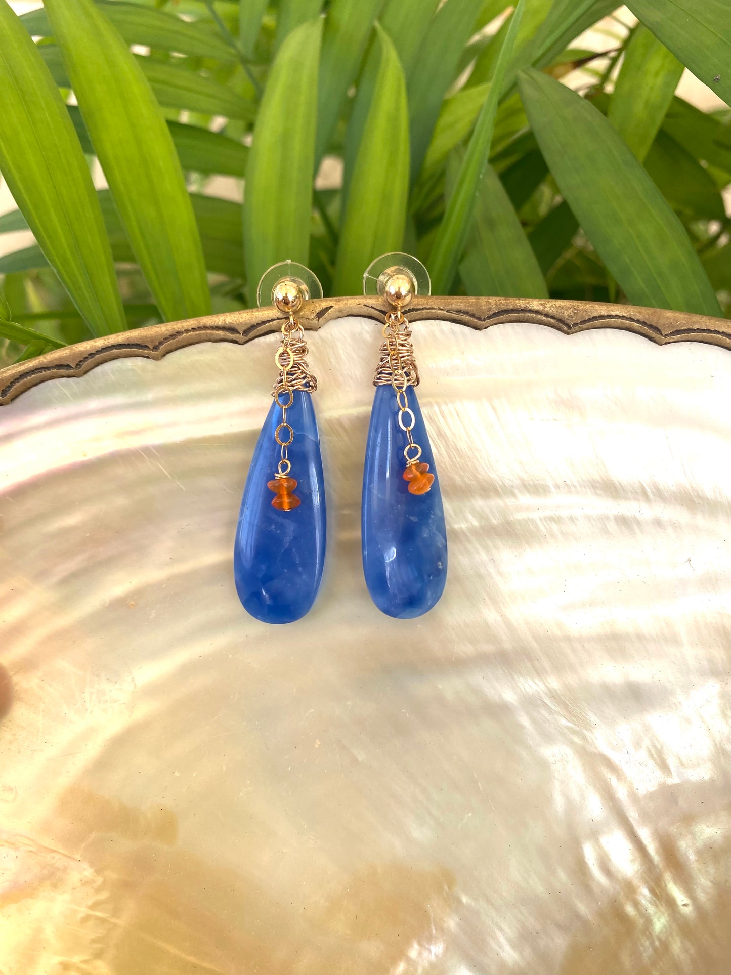Blue Onyx Carnelian Earrings featuring teardrop blue onyx stones with carnelian accents, handmade in Canada.