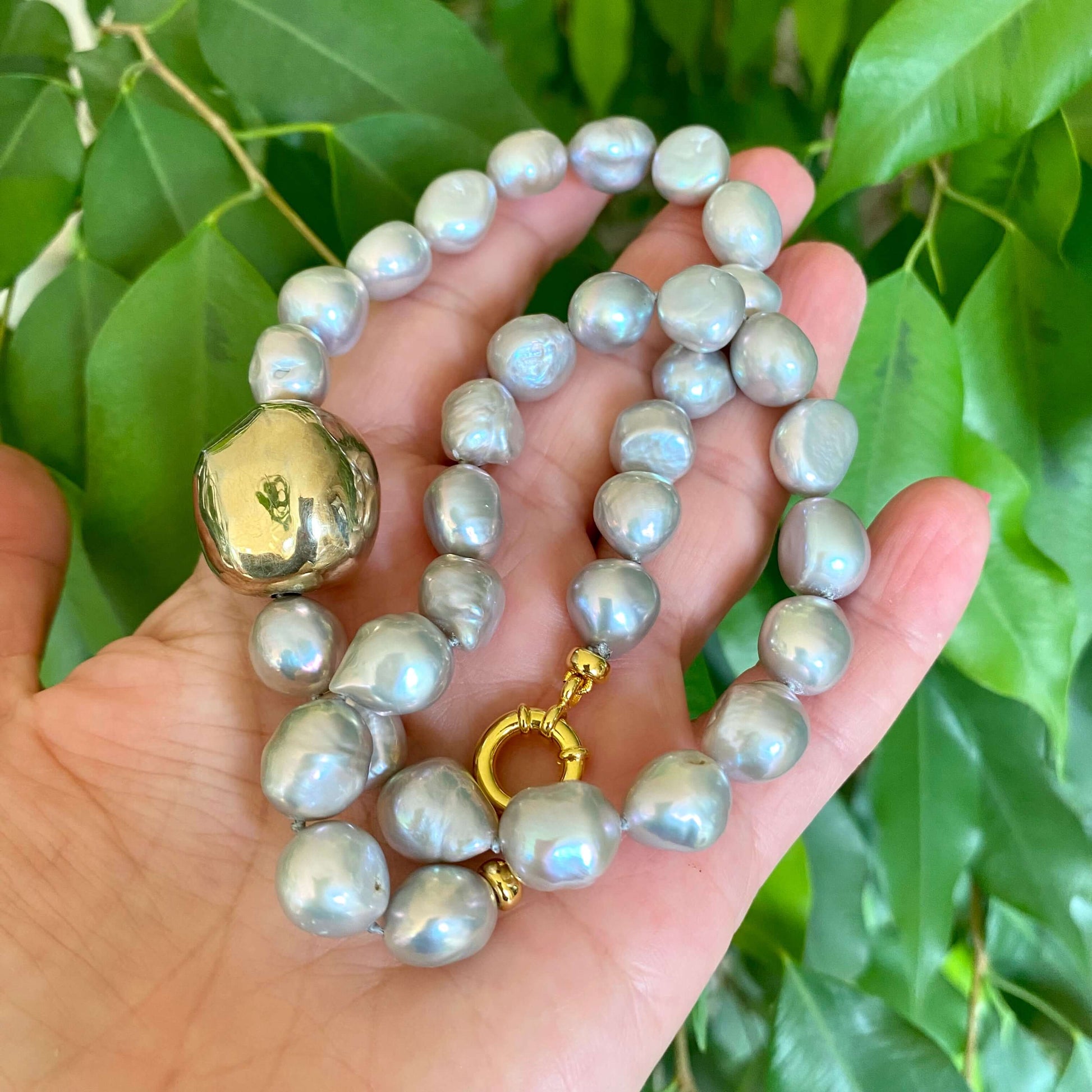 Grey pearl necklace with gold marine clasp highlighting gold vermeil marine clasp detail