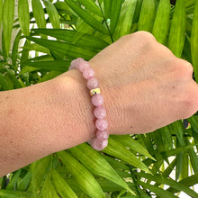 Load image into Gallery viewer, Rose Quartz Pearl Bracelet worn on model’s wrist – individual bracelet lifestyle shot
