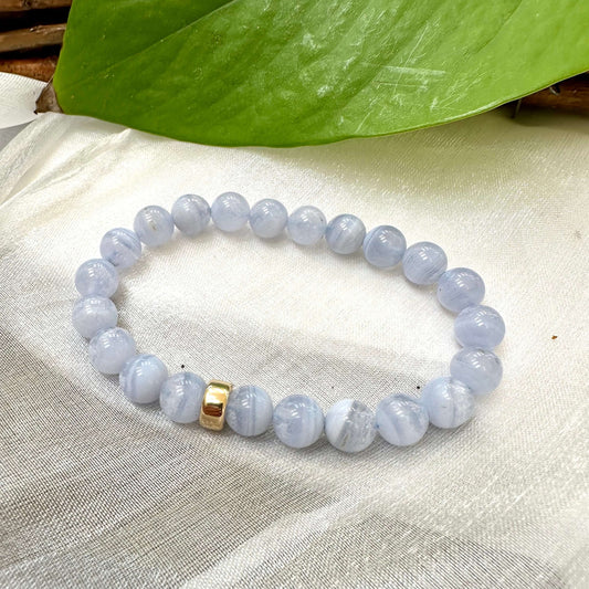 Blue Lace Agate Bracelet displayed on white cloth – gemstone bead close-up