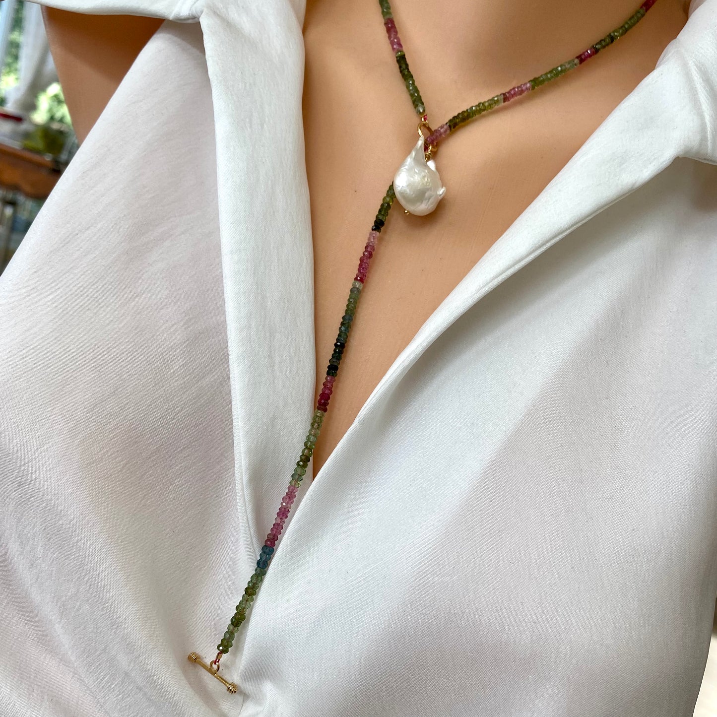 Tourmaline baroque pearl toggle necklace worn on model featuring gold vermeil clasp and pearl pendant