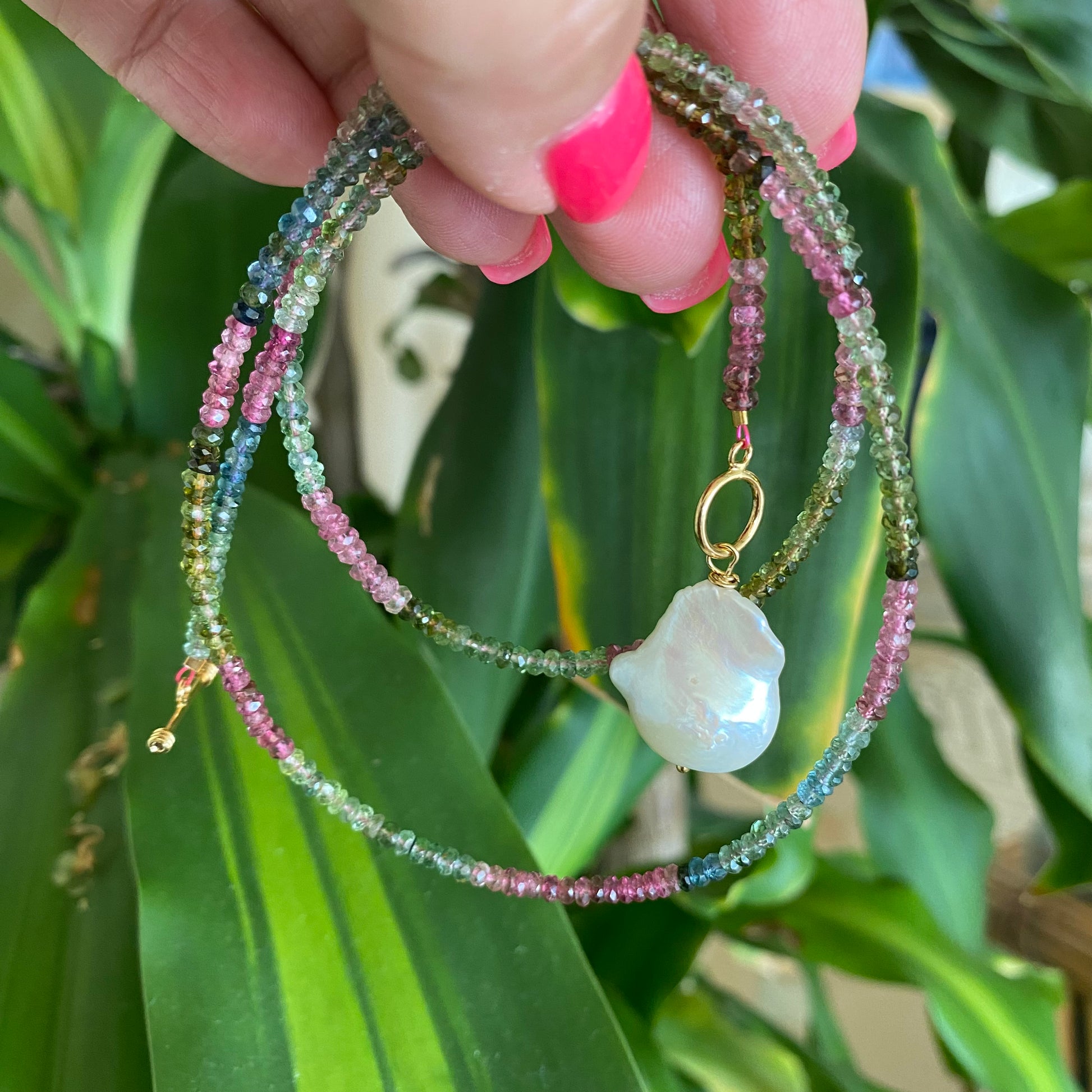 Tourmaline baroque pearl toggle necklace photographed outdoors highlighting toggle clasp detail