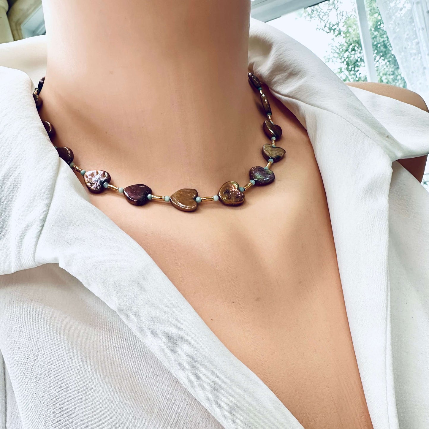 Bronze pearl choker shown in side view on mannequin with gold vermeil accents