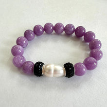Load image into Gallery viewer, Lavender jade bracelet with one pearl displayed on white cloth
