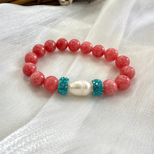 Load image into Gallery viewer, Red jade bracelet with pearl and blue rhinestones displayed on white cloth

