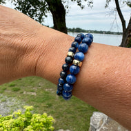 Blue kyanite bracelet worn on female wrist, stacked with another bracelet