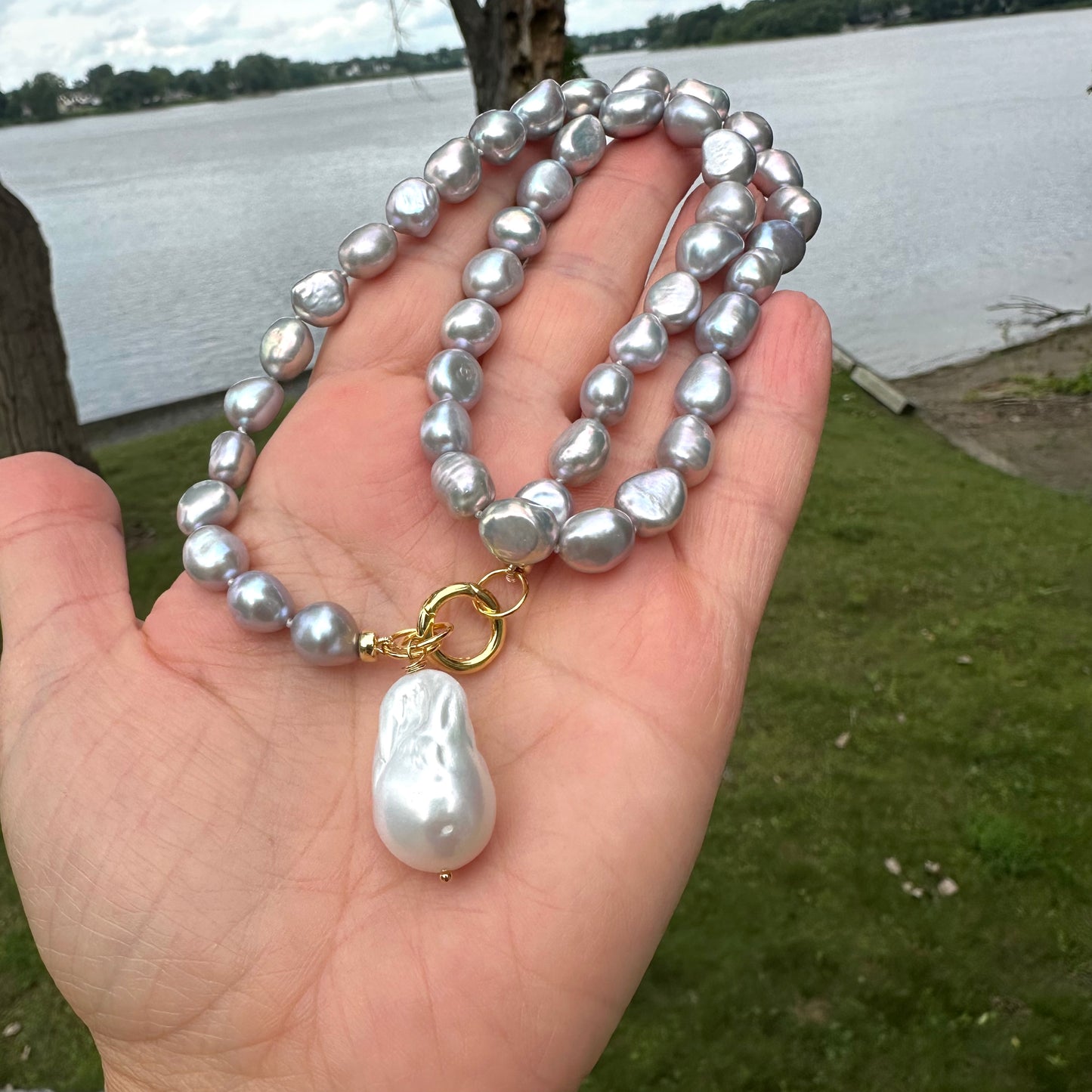 Grey pearl necklace with white baroque pearl pendant, handcrafted with freshwater nuggets, showcasing elegant charm.