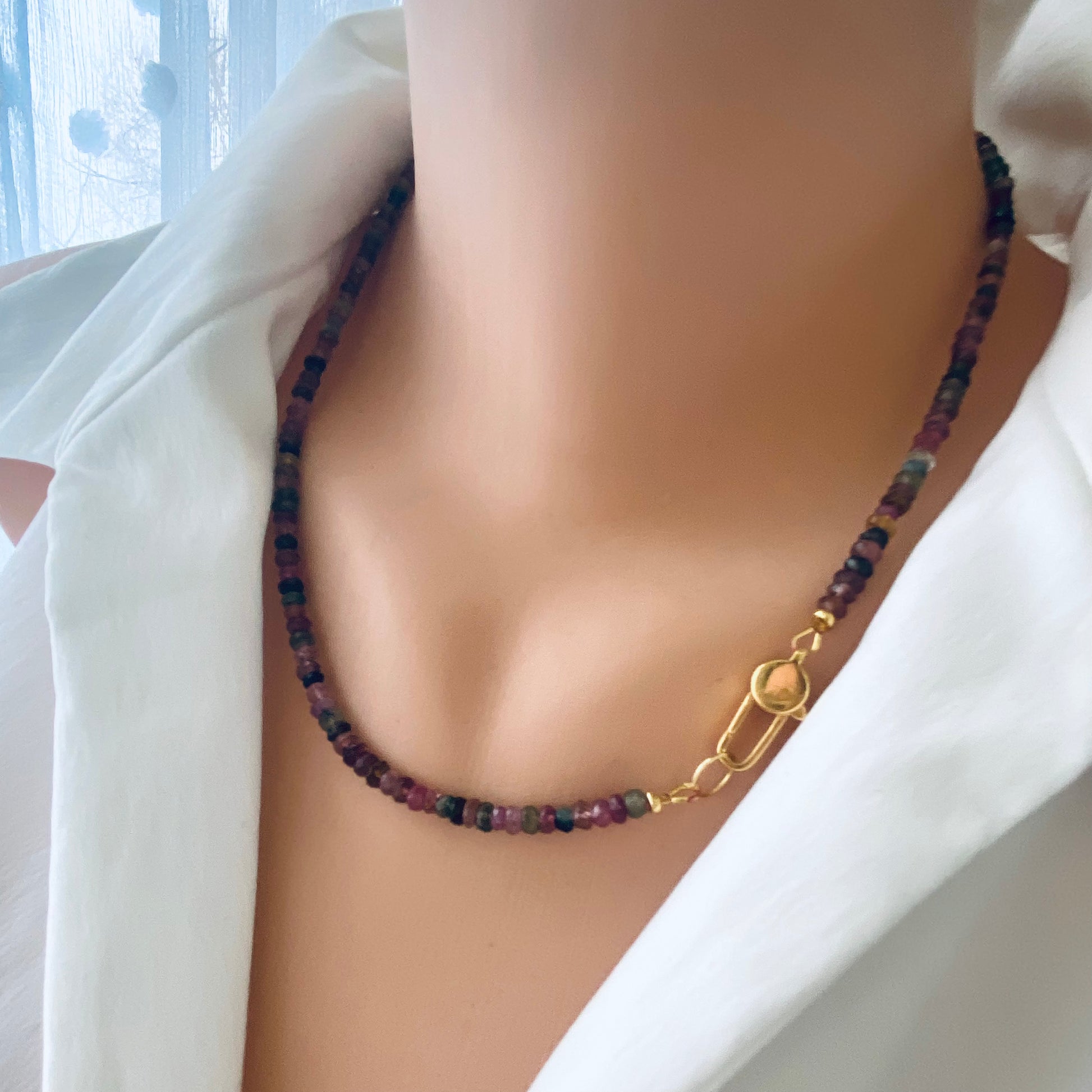 Watermelon tourmaline necklace on mannequin showing bead color variation