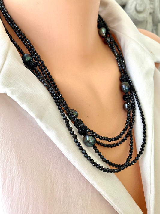 Black spinel pearl necklace worn on mannequin, front close-up